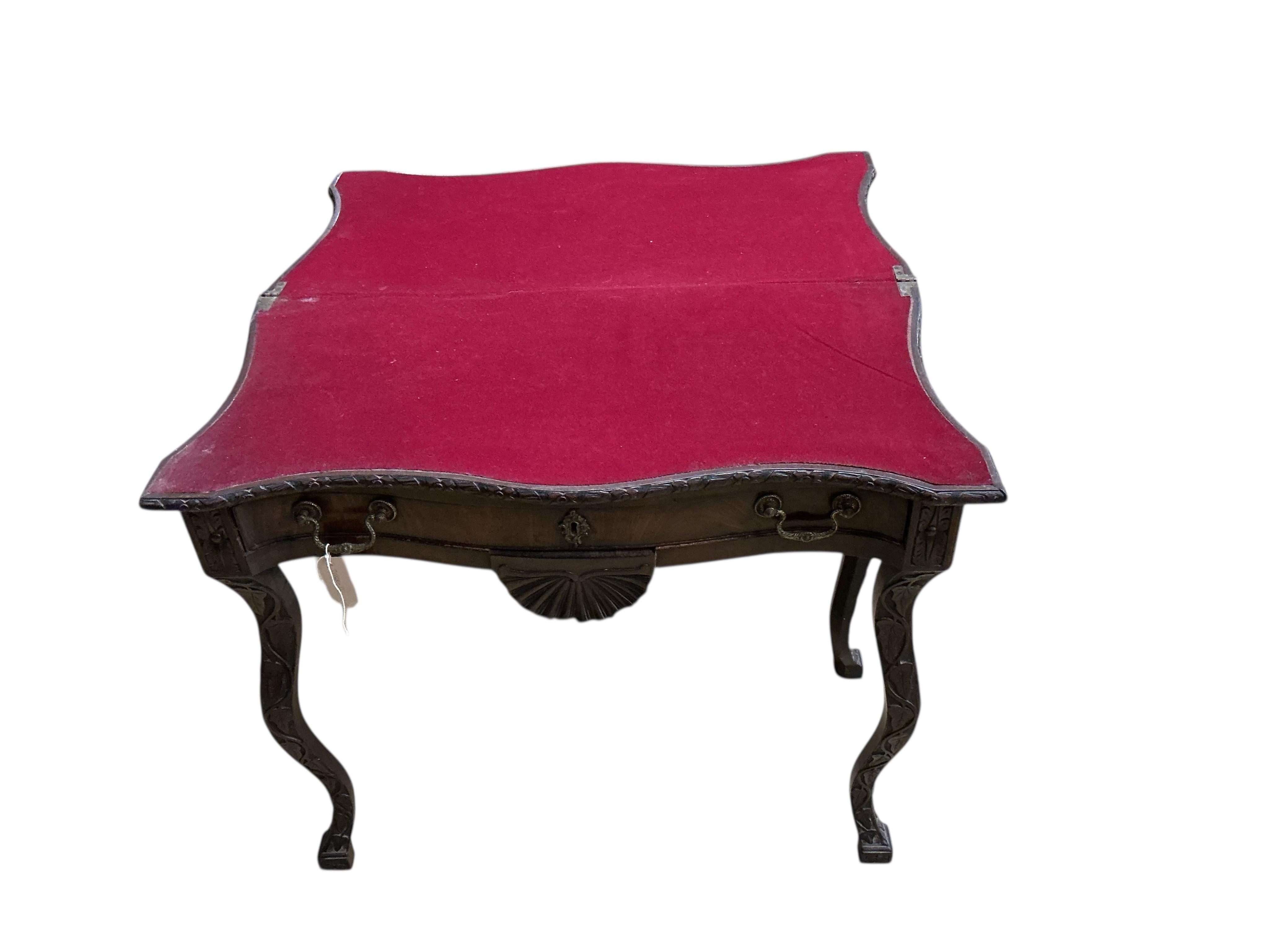 A George II style serpentine mahogany folding card table, width 86cm, depth 43cm, height 73cm